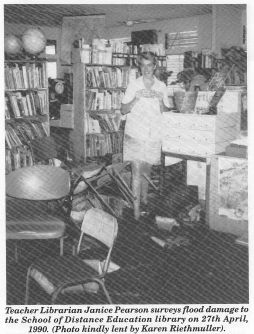 Teacher Librarian Janice Pearson surveys flood damage to the School of Distance Education library on 27th April, 1990